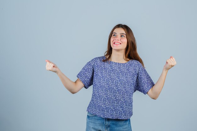 Expressive young woman posing in the studio