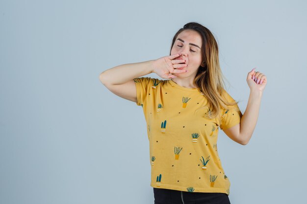 Expressive young woman posing in the studio