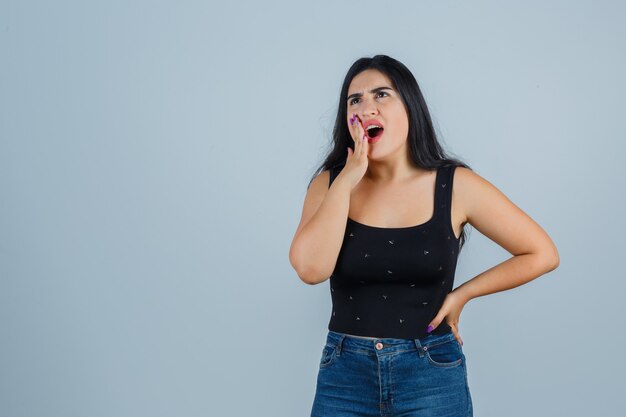 Expressive young woman posing in the studio