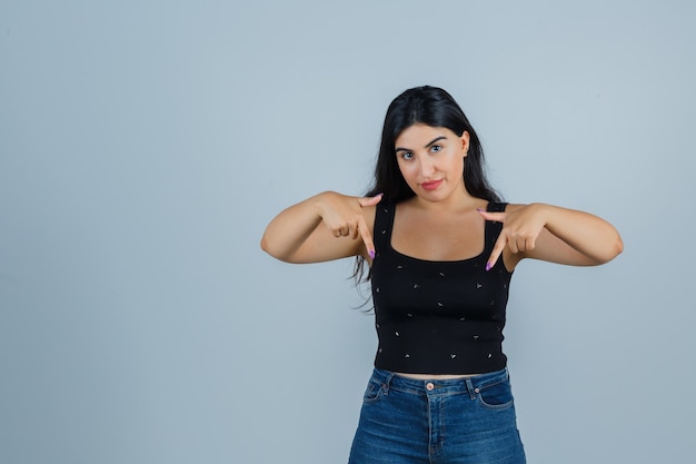 Expressive young woman posing in the studio