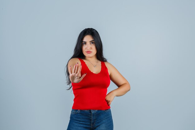 Expressive young woman posing in the studio