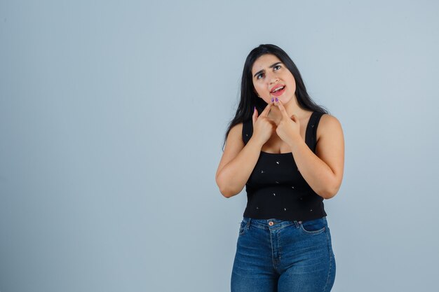 Expressive young woman posing in the studio