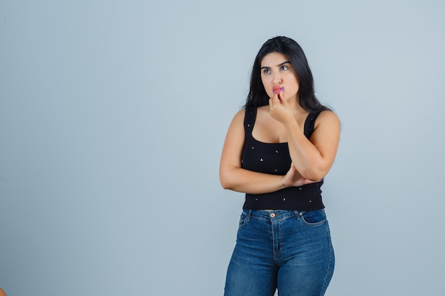 Expressive young woman posing in the studio