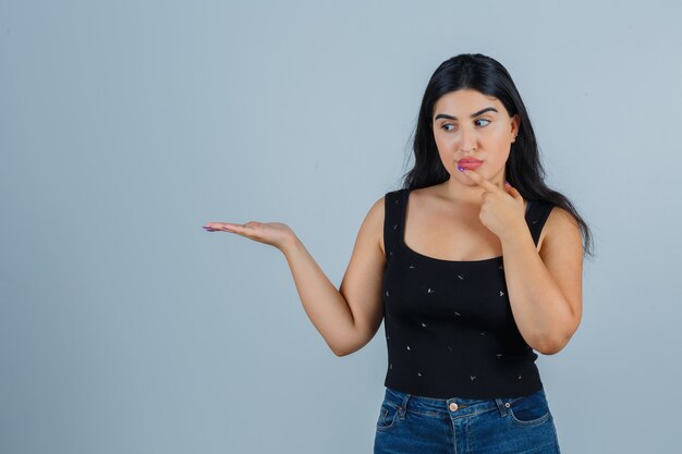 Expressive young woman posing in the studio