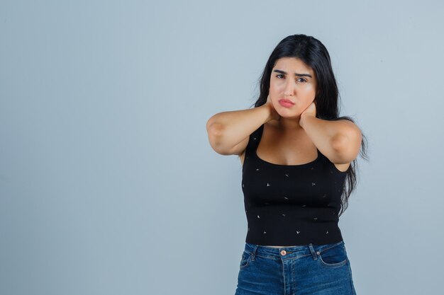 Expressive young woman posing in the studio