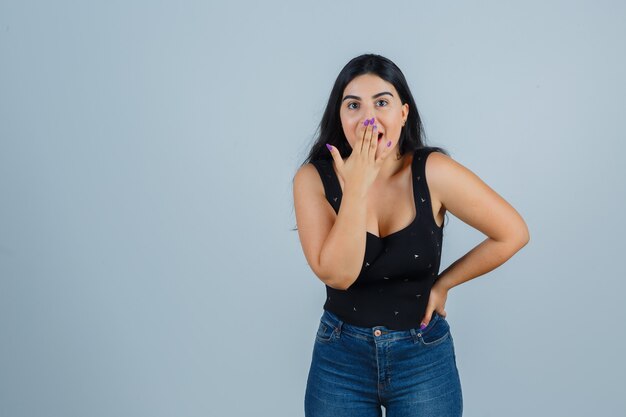 Expressive young woman posing in the studio