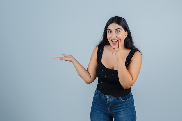 Expressive young woman posing in the studio