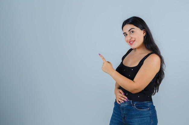 Expressive young woman posing in the studio