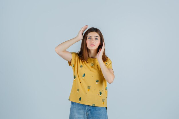 Expressive young woman posing in the studio