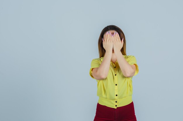 Expressive young woman posing in the studio