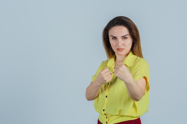 Expressive young woman posing in the studio