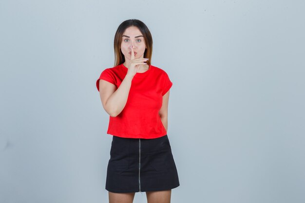 Expressive young woman posing in the studio