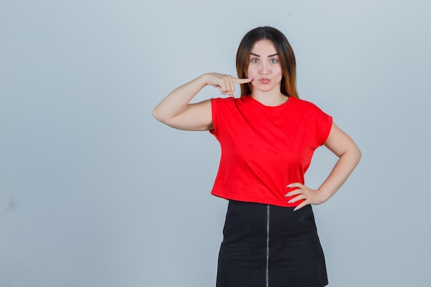 Expressive young woman posing in the studio