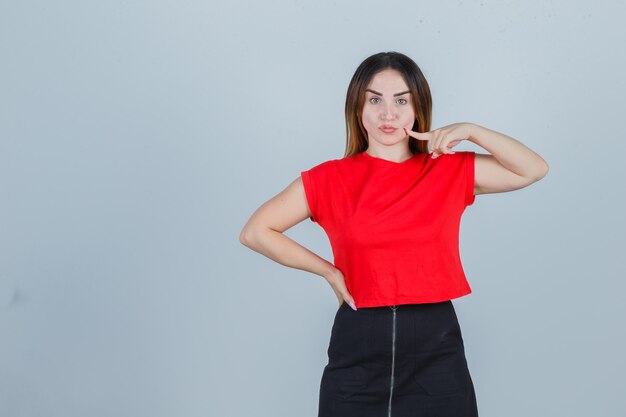 Expressive young woman posing in the studio