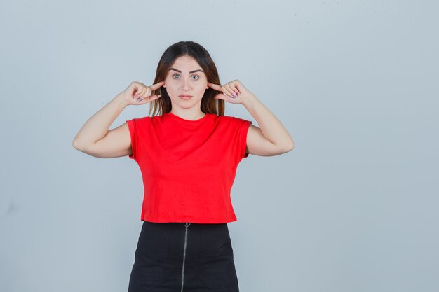 Expressive young woman posing in the studio