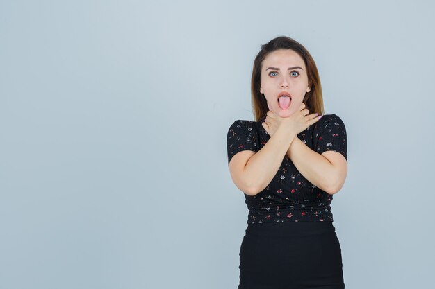 Expressive young woman posing in the studio