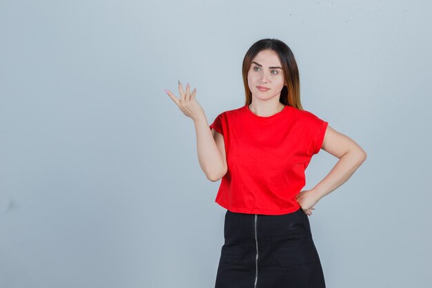 Expressive young woman posing in the studio