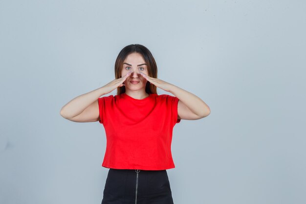 Expressive young woman posing in the studio