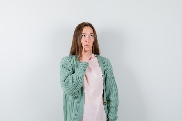 Expressive young woman posing in the studio