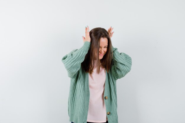 Expressive young woman posing in the studio