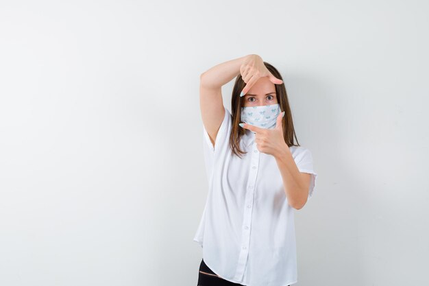 Expressive young woman posing in the studio