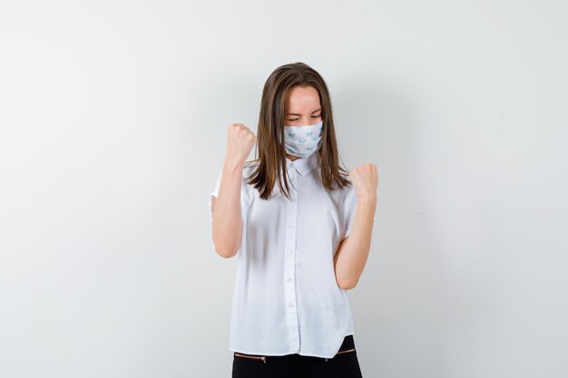 Expressive young woman posing in the studio