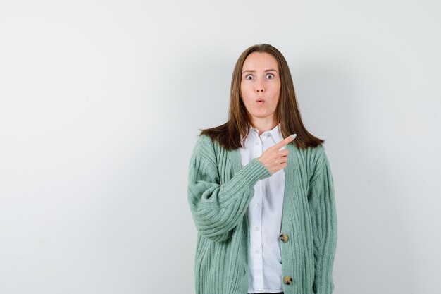 Expressive young woman posing in the studio