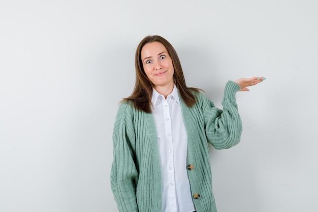 Expressive young woman posing in the studio