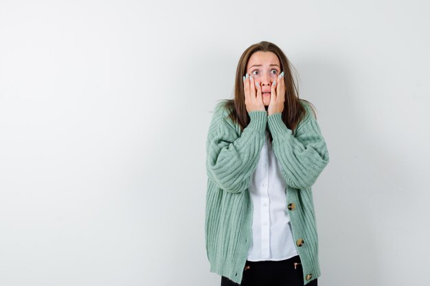 Expressive young woman posing in the studio