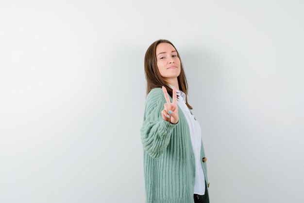 Expressive young woman posing in the studio