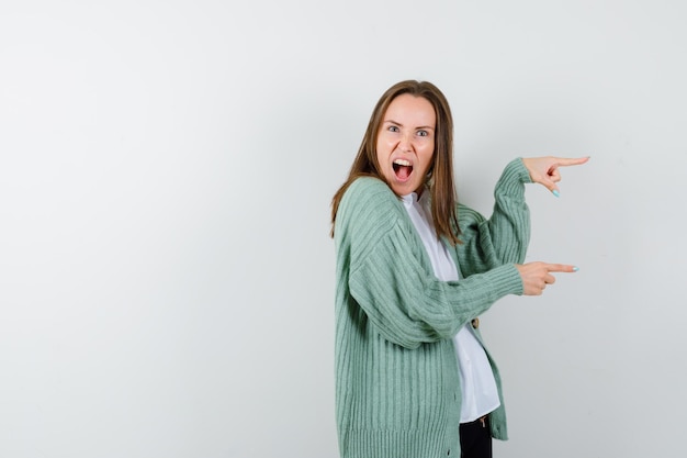 Expressive young woman posing in the studio