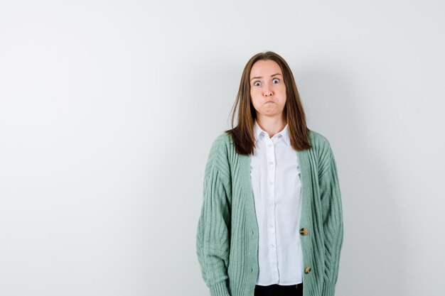 Expressive young woman posing in the studio