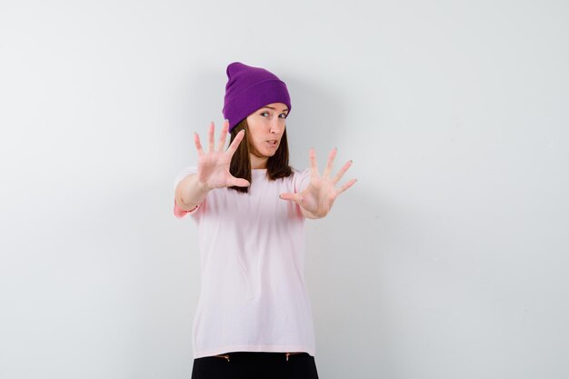 Expressive young woman posing in the studio