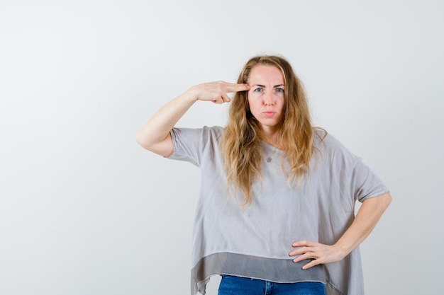 Expressive young woman posing in the studio