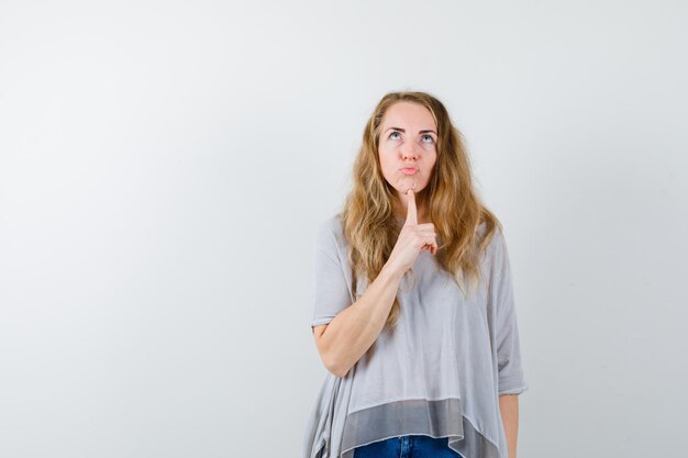 Expressive young woman posing in the studio