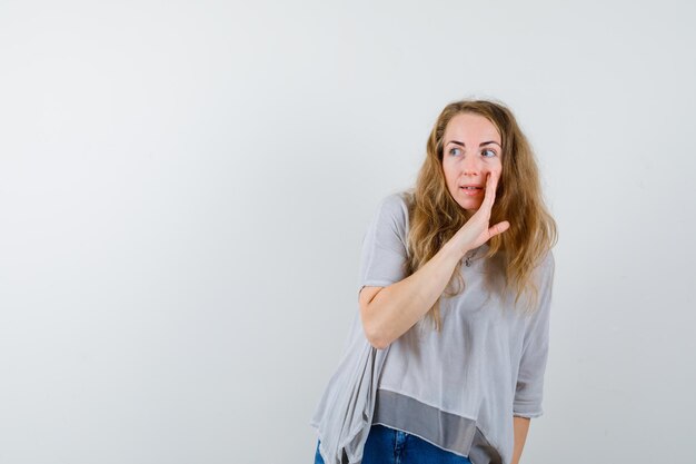 Expressive young woman posing in the studio