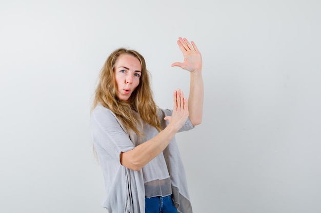 Expressive young woman posing in the studio