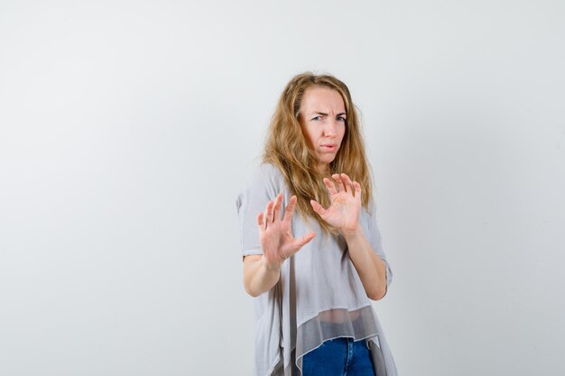 Expressive young woman posing in the studio