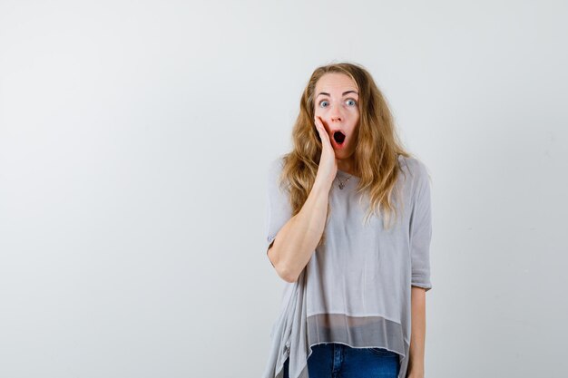 Expressive young woman posing in the studio