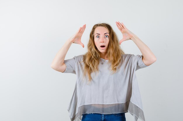 Expressive young woman posing in the studio