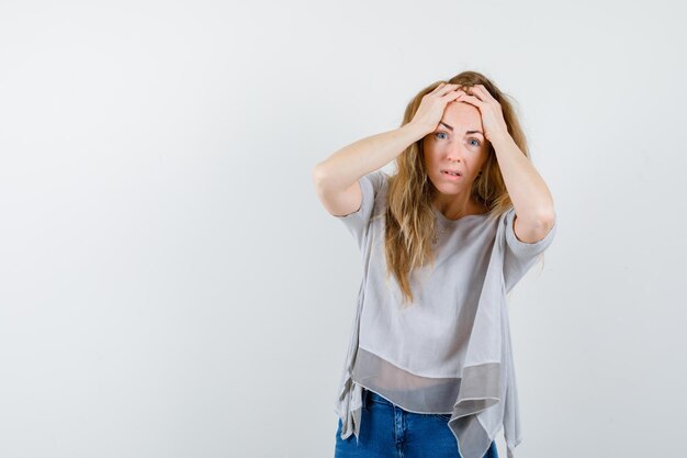 Expressive young woman posing in the studio