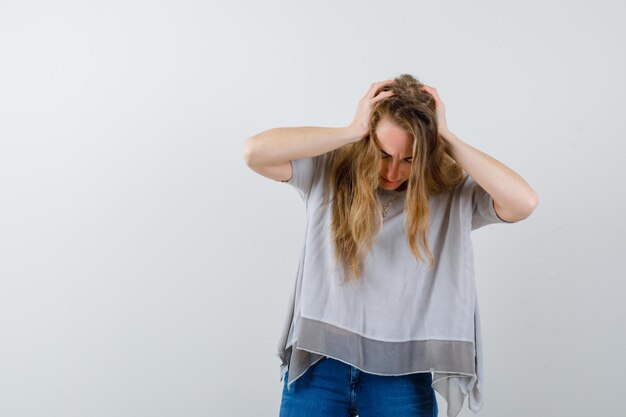 Expressive young woman posing in the studio