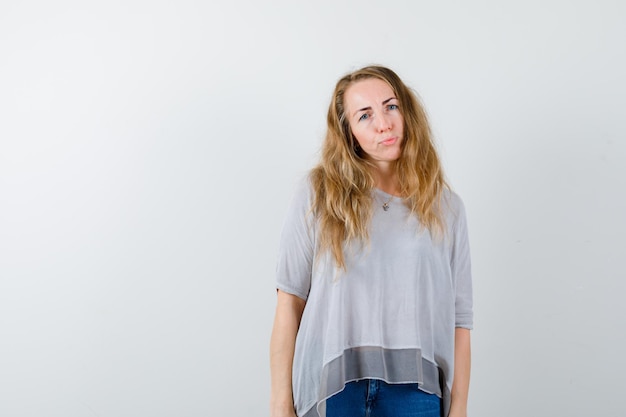 Expressive young woman posing in the studio