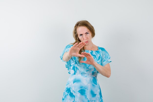 Expressive young woman posing in the studio