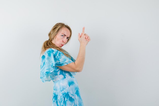 Expressive young woman posing in the studio