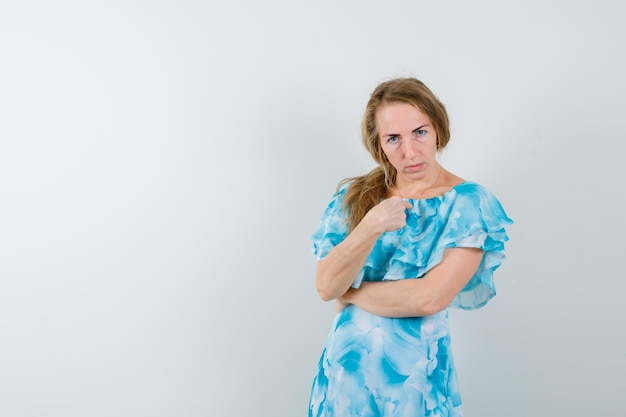 Expressive young woman posing in the studio