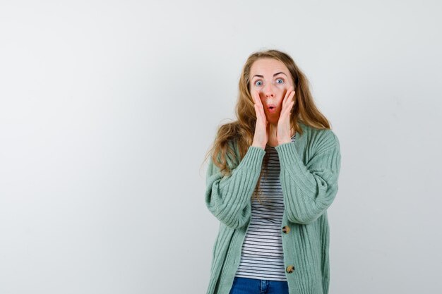 Expressive young woman posing in the studio