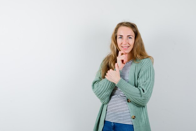 Expressive young woman posing in the studio