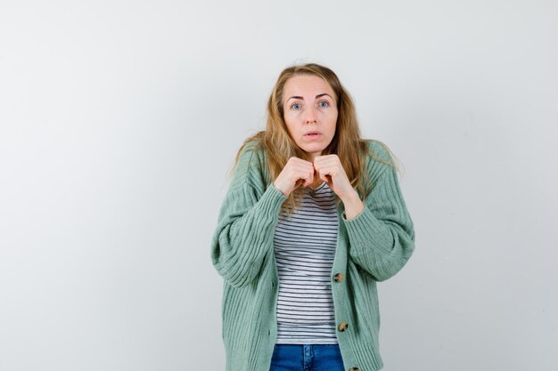 Expressive young woman posing in the studio