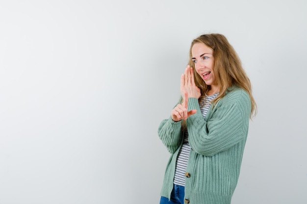 Expressive young woman posing in the studio